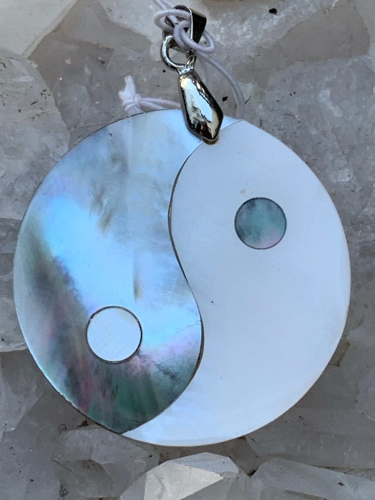 Yin-Yang, pendant in genuine mother-of-pearl shell, 3.2 centimeters in diameter, sold with an adjustable black cord with a 0.925 silver clasp. Natural elegance &amp; a symbol of balance!