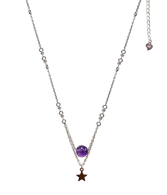 Collier en Argent 925 de 42 cm de long, accompagné d'une délicate chainette de 5 cm. Orné d'une élégante perle d'améthyste de 8 mm ainsi qu'une étoile !