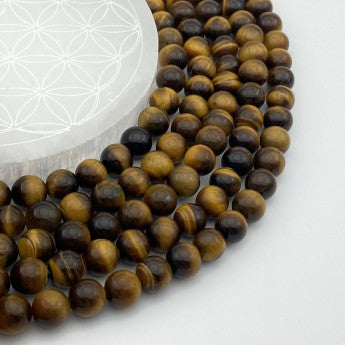 Œil de Tigre, perles rondes de 4, 6, 8 ou 10 mm. Vendu en fil de perle 38/39 cm, en bracelet de 17 à 21cm, en collier de 45 ou sautoir de 60cm. Qualité AA à AAA, superbes perles, belle pureté, parfait !